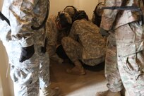 FORT MCCOY, Wis. -- Army Reserve Soldiers from the 603rd Military Police Company out of Kansas City, Mo., restrain an unruly detainee simulated by another Soldier in the unit as part of the Combat Support Training Exercise here in Fort McCoy, Wis. on Aug. 14, 2016. CSTX immerses Army Reserve Soldiers and other service members in real-world training scenarios to enhance unit readiness in the planning, preparation, and execution of combat service support operations. (U.S. Army Reserve photo by Spc. Christopher A. Hernandez, 345th Public Affairs Detachment)