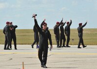 Members of the U.S. Army Golden Knights wave to the crowd of spectators during the Northern Neighbors Day Air Show at Minot Air Force Base, N.D., Aug. 13, 2016. The Golden Knights perform annually at more than 100 events around the U.S. (U.S. Air Force photo/Airman 1st Class Jonathan McElderry)