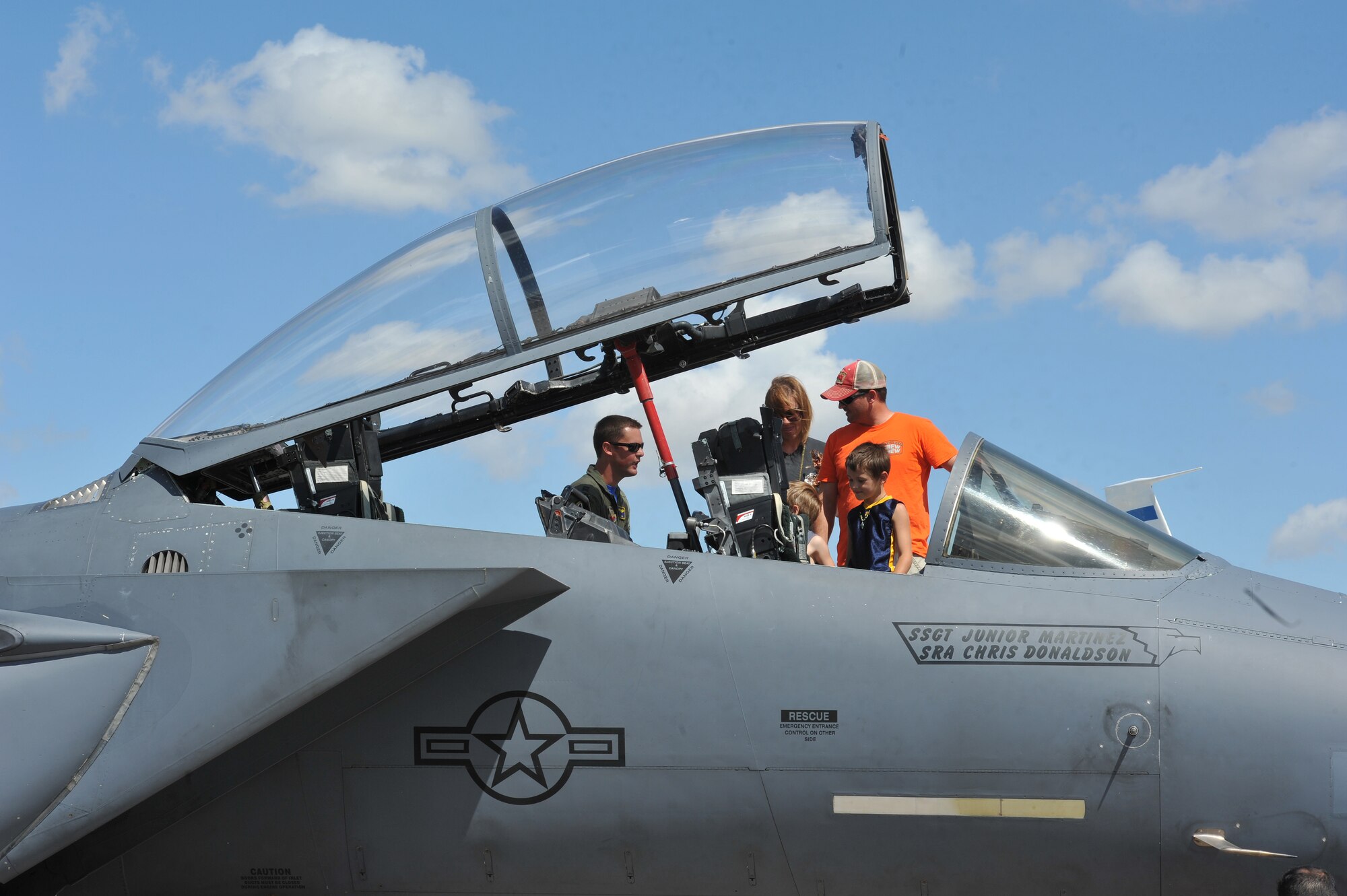 A family views the inside of an F-15E Strike Eagle during the Northern Neighbors Day Air Show at Minot Air Force Base, N.D., Aug. 13, 2016. The F-15 is one of the most successful modern fighter aircrafts in the U.S. (U.S. Air Force photo/Airman 1st Class Jonathan McElderry)