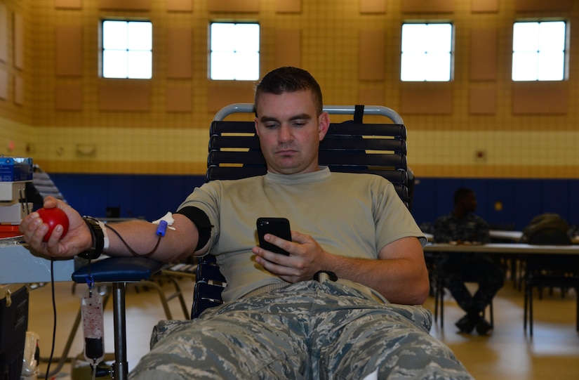 U.S. Air Force Staff Sgt. Malcolm, 17th Intelligence Squadron, intelligence analyst, donates blood to the Armed Services Blood Program during a donation drive at Langley Air Force Base, Va., Aug. 10, 2016. The Armed Services Blood Program has a bi-monthly blood drive at the Langley Air Force Base Community Commons. (U.S. Air Force photo by Airman 1st Class Tristan Biese)
