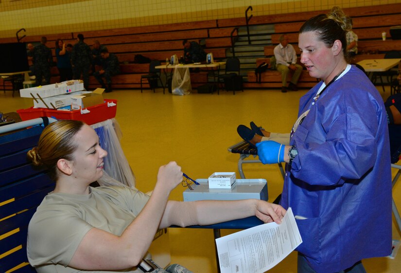 U.S. Air Force 1st Lt. Robin Taylor, 633rd Communication Squadron communications focal point officer in charge, donates blood to the Armed Services Blood Program during a donation drive at Langley Air Force Base, Va., Aug. 10, 2016. The mission of Armed Services Blood Program is to provide blood that is required for active duty personnel worldwide, as well as their dependents. (U.S. Air Force photo by Airman 1st Class Tristan Biese)