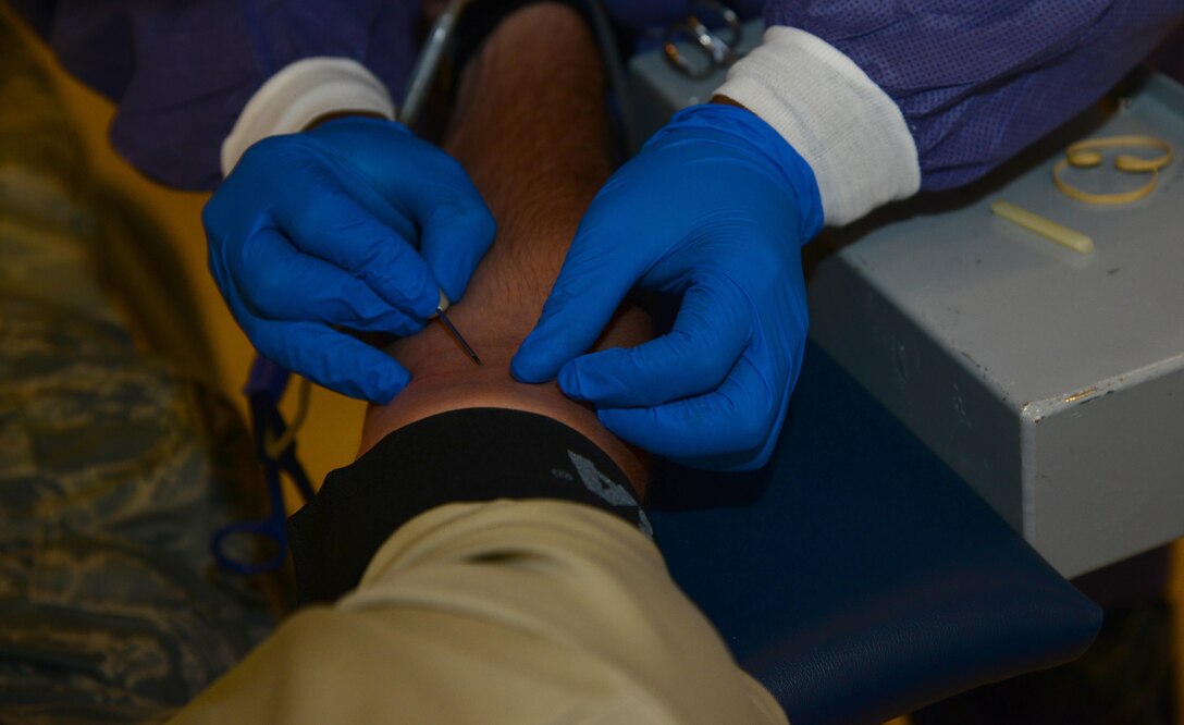 A U.S. Air Force Airman donates blood to the Armed Services Blood Program during a donation drive at Langley Air Force Base, Va., Aug. 10, 2016. There are 22 blood donor centers in the world that serve this mission, 19 of which are in the U.S. (U.S. Air Force photo by Airman 1st Class Tristan Biese)