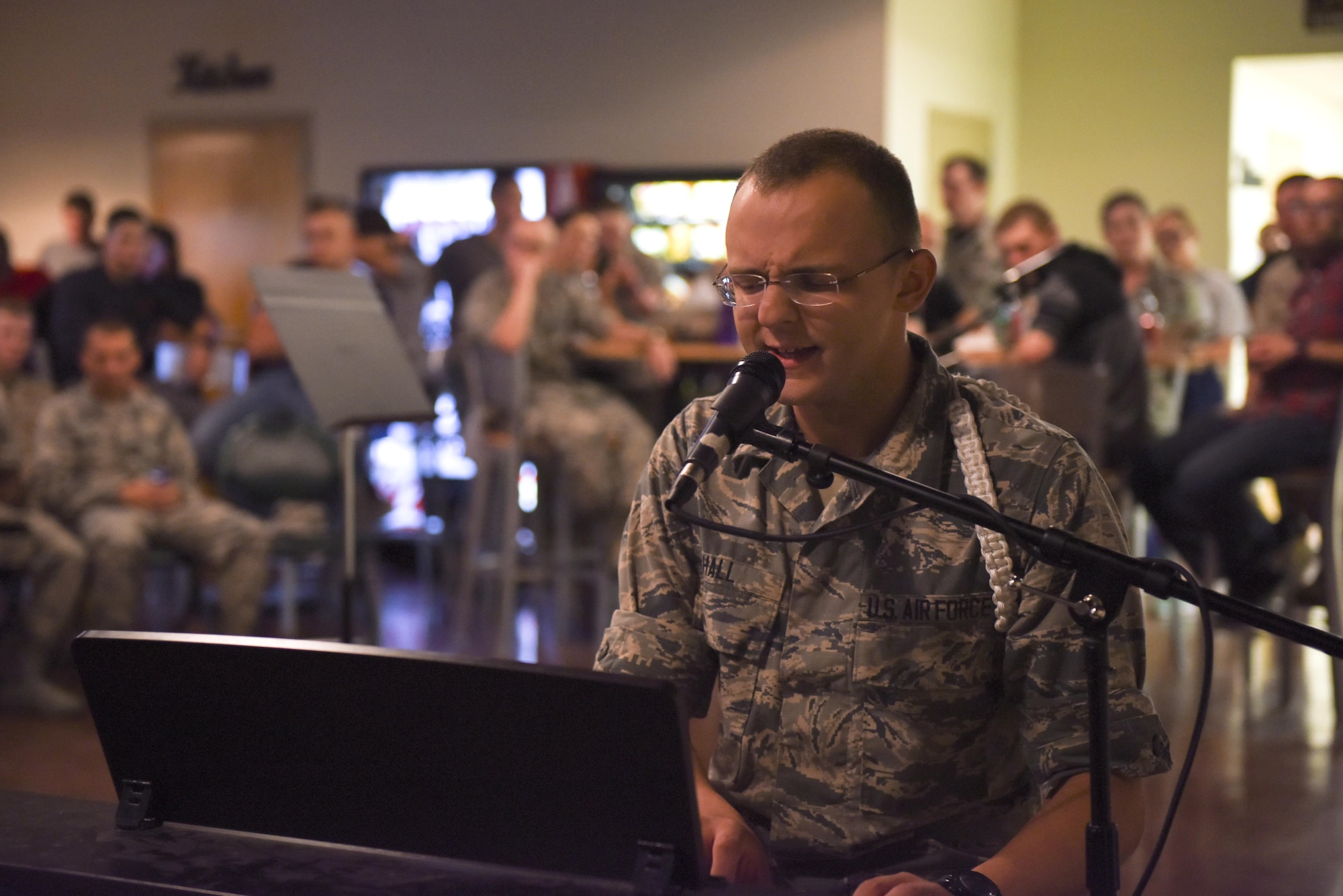 U.S. Air Force Airman Wyatt Hall, 316th Training Squadron student, sings while playing the piano at Crossroads Student Center on Goodfellow Air Force Base, Texas, Aug. 13, 2016. The performance was part of Goodfellow’s Got Talent, an event showcasing students’ different talents. (U.S. Air Force photo by Airman 1st Class Chase Sousa/Released)