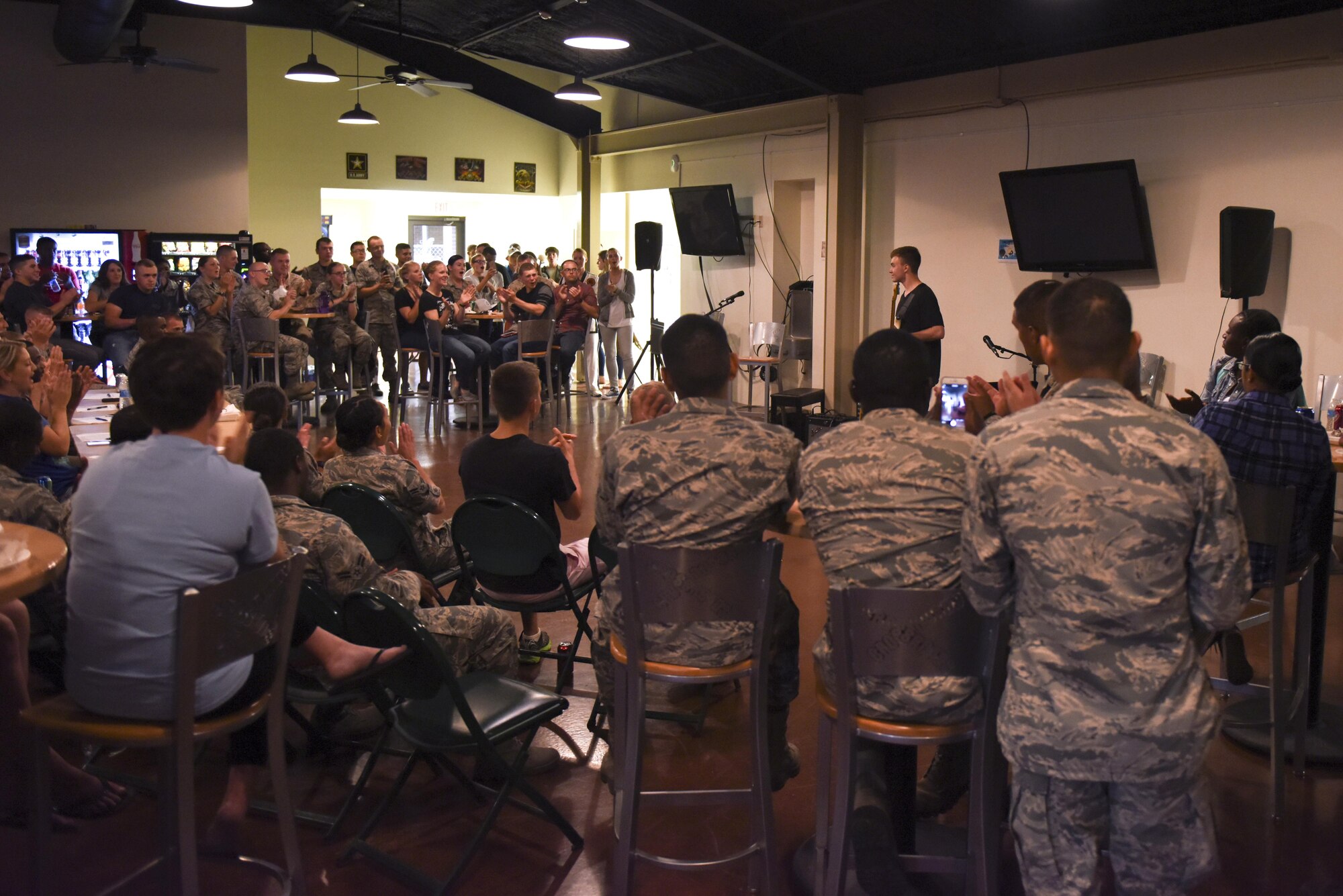 Goodfellow students watch a talent show at Crossroads Student Center on Goodfellow Air Force Base, Texas, Aug. 13, 2016. Goodfellow’s Got Talent showcased singing, guitar and piano playing, and more. (U.S. Air Force photo by Airman 1st Class Chase Sousa/Released)