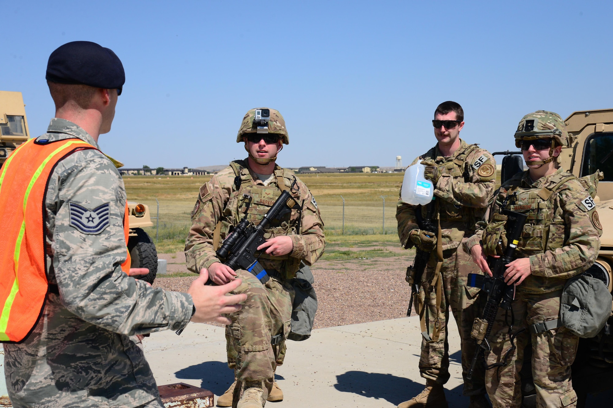 Tech. Sgt. Zachary Linton, 341st Missile Security Forces Squadron NCO in charge of training, coaches Airmen Aug. 5, 2016, at Malmstrom Air Force Base, Mont. The 341st MSFS implemented the All-In Action Plan which is an attention to detail campaign designed to improve processes to ensure mission requirements are executed safely, securely and effectively. (U.S. Air Force photo/Airman 1st Class Magen M. Reeves)