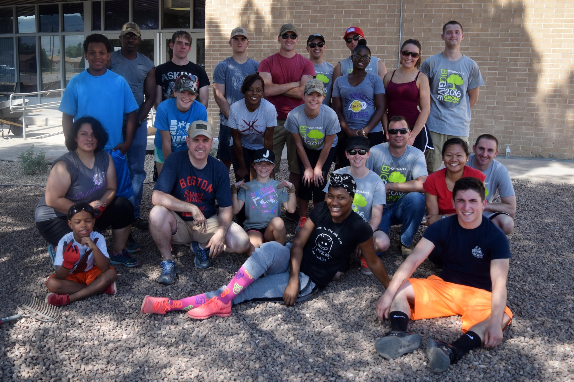 Volunteers from the Holloman community pose for a group photo at Sierra Elementary School in Alamogordo, N.M., on July 30, 2016. Members of the base volunteered over the course of several weeks to survey the location and provide landscaping services. (U.S. Air Force photo by Staff Sgt. Eboni Prince)