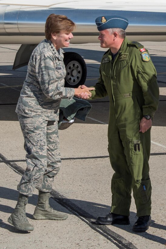 Major-General Christian Drouin (right), Commander of 1 Canadian Air Division, welcomes General Lori Robinson (left), Commander of the North American Aerospace Defense Command and U.S. Northern Command, to 4 Wing Cold Lake, Alberta, Canada, August 15, 2016.