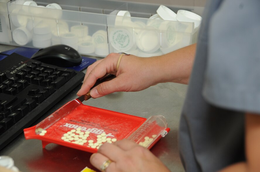 Julie Reeves, 2nd Medical Group pharmacy technician, counts medication to fill a prescription at Barksdale Air Force Base, La., Aug. 16, 2016. The medicince that isn’t used goes into the pyxis, or the narcotics safe. (U.S. Air Force photo/Airman 1st Class Stuart Bright)