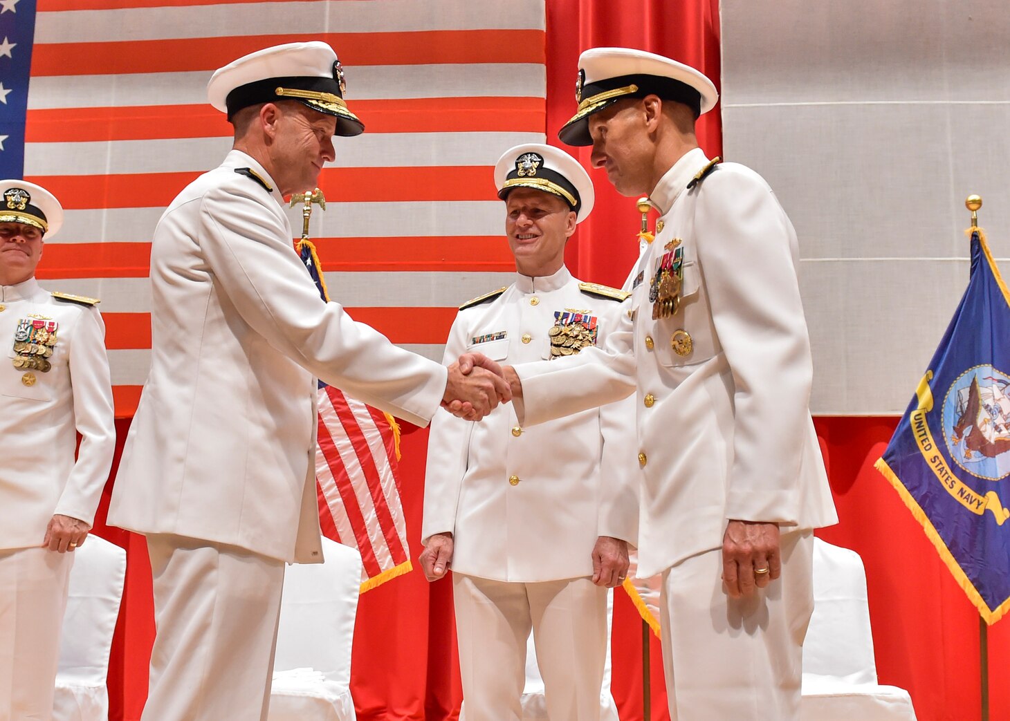 FLEET ACTIVITIES YOKOSUKA, Japan (Aug. 17, 2016) Rear Adm. William R. Merz shakes hands with Rear Adm. Richard A. Correll during a change their command ceremony. Correll relieved Merz as the 45th commander of Submarine Group 7. (U.S. Navy photo by Mass Communication Specialist 2nd Class Brian G. Reynolds)
