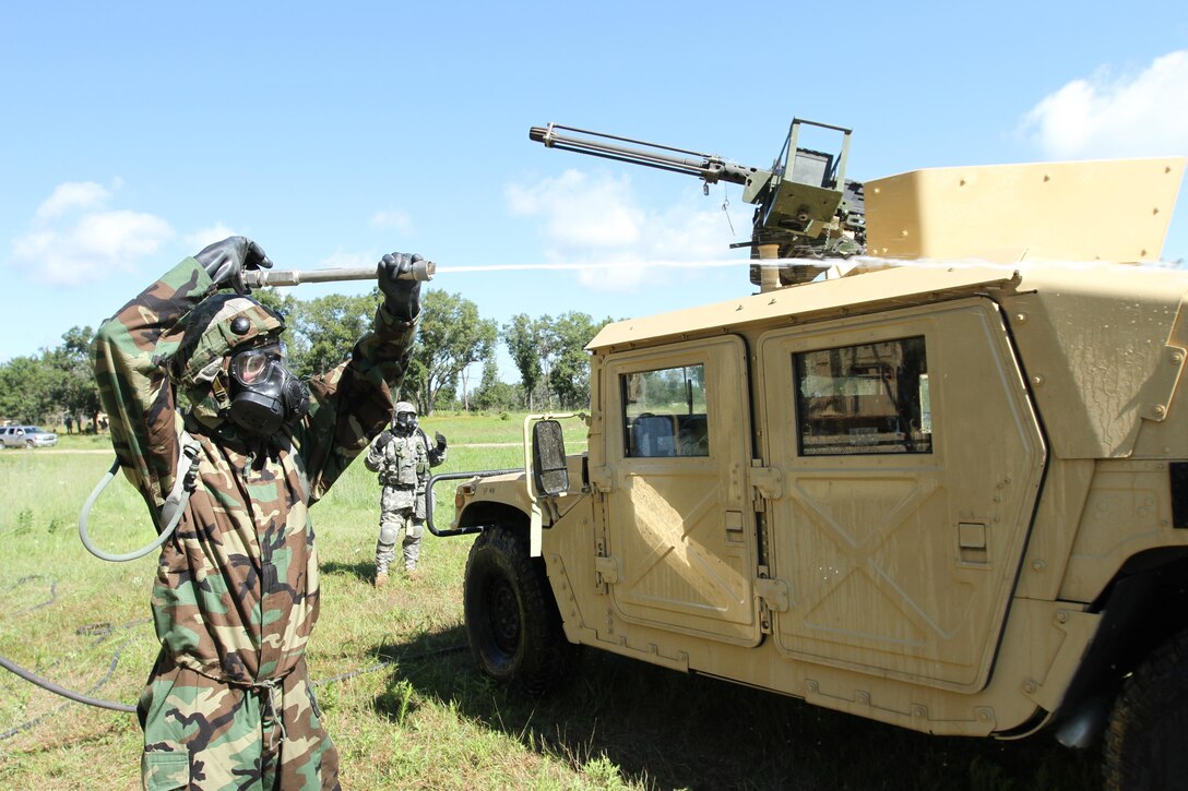 Army Reserve Soldiers from the 340th Chemical Company out of Houston, Texas, perform heavy decontamination of tactical vehicles during a training event as part of the Combat Support Training Exercise (CSTX) here in Fort McCoy, Wis. on Aug. 14. CSTX immerses Army Reserve soldiers and other service members in real-world training scenarios to enhance unit readiness in the planning, preparation, and execution of combat service support operations. (U.S. Army photo by Spc. Christopher A. Hernandez, 345th Public Affairs Detachment)