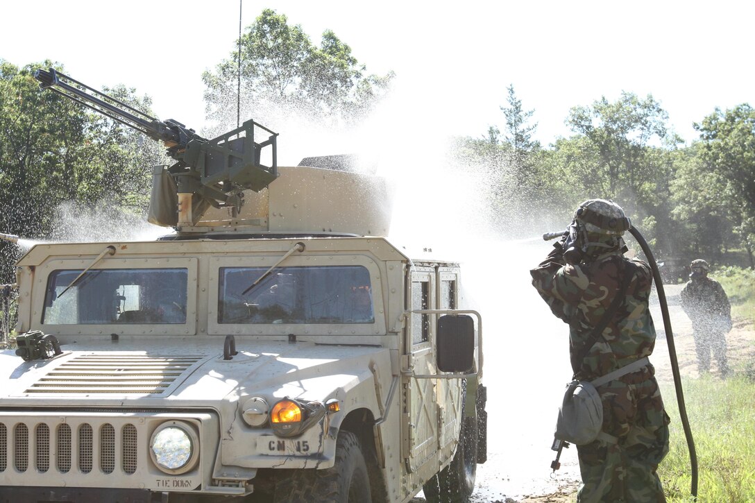 Army Reserve Soldiers from the 340th Chemical Company out of Houston, Texas, perform heavy decontamination of tactical vehicles during a training event as part of the Combat Support Training Exercise here in Fort McCoy, Wis. on Aug. 14, 2016. CSTX immerses Army Reserve soldiers and other service members in real-world training scenarios to enhance unit readiness in the planning, preparation, and execution of combat service support operations. (U.S. Army Reserve photo by Spc. Christopher A. Hernandez, 345th Public Affairs Detachment)