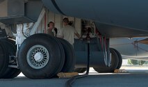 Airman 1st Class Thomas Fisher, 92nd Maintenance Group crew chief, discusses checklist items with another crew chief as his assigned KC-135 is being refueled Aug. 16, 2016, at Fairchild Air Force Base, Wash. Refueling actions on a dry KC-135 may take approximately an hour or longer depending on the demand for fuel at a given time. (U.S. Air Force photo/ Airman 1st Class Ryan Lackey)