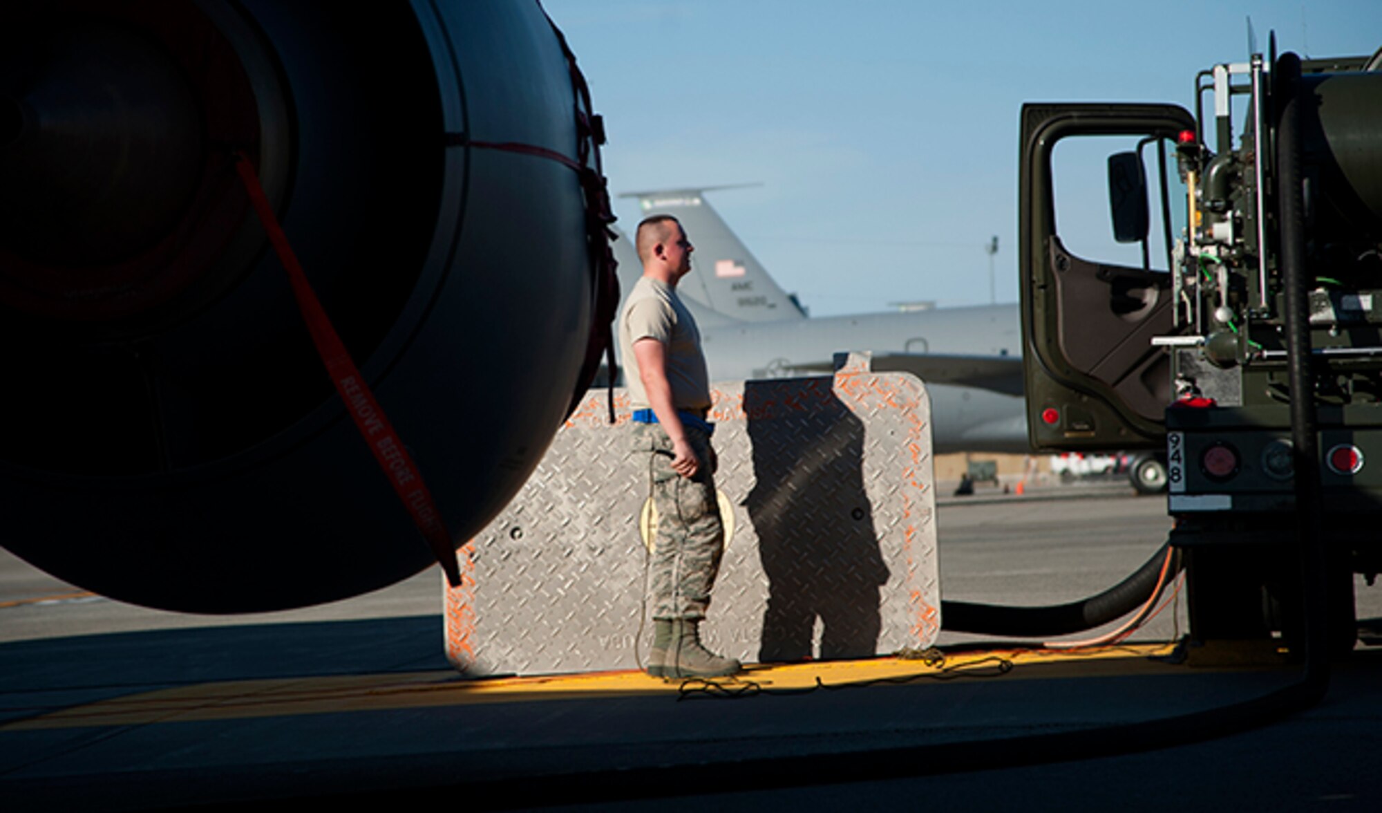 Airman 1st Class David Renzo, 92nd Logistics Readiness Squadron refueling equipment operator, monitors the fuel pressure gauges on his assigned hydrant truck as it fuels up a KC-135 Aug. 16, 2016, at Fairchild Air Force Base, Wash. Refueling actions on a dry KC-135 may take approximately an hour or longer depending on the demand for fuel at a given time. (U.S. Air Force photo/ Airman 1st Class Ryan Lackey)