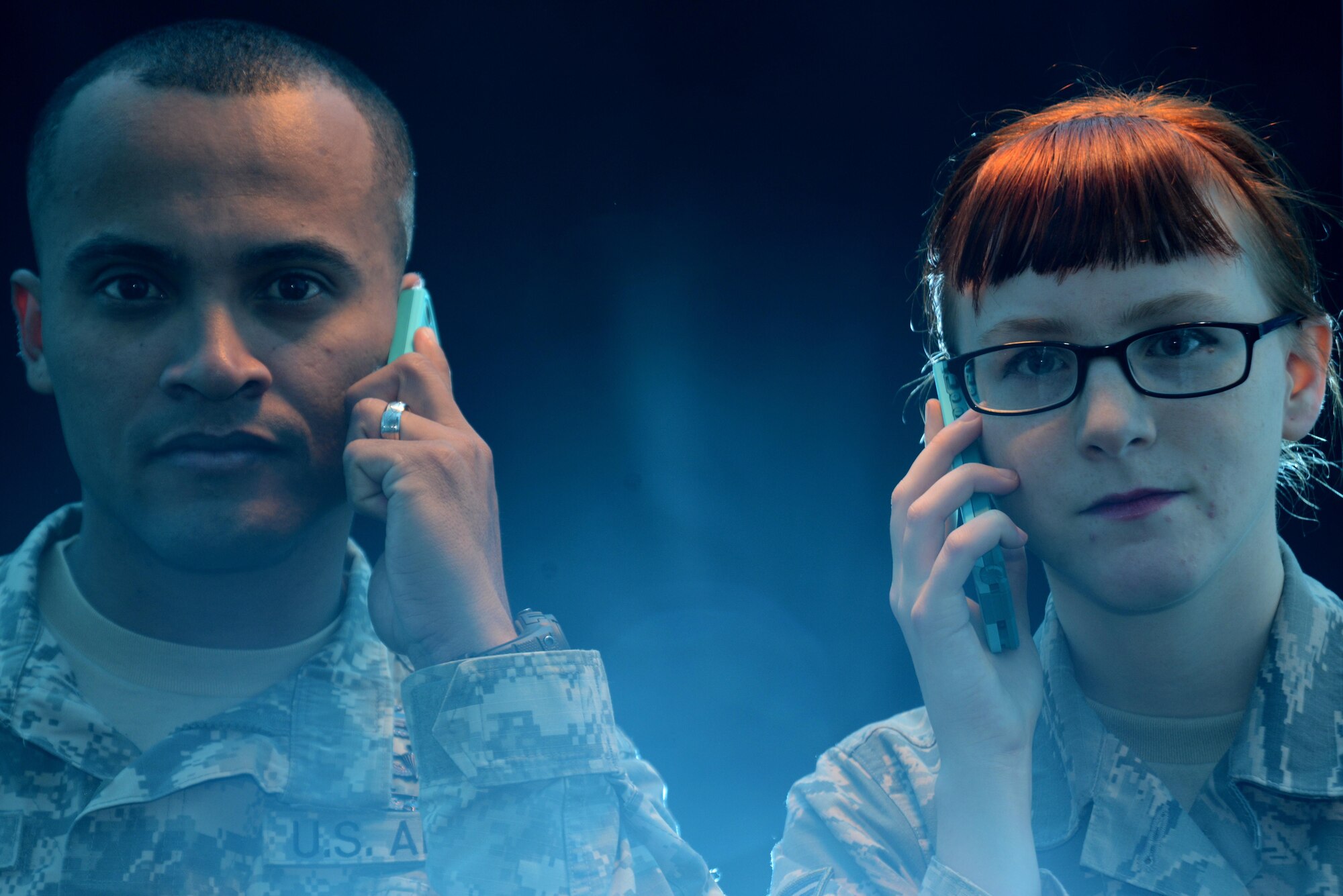 Army Staff Sgt. Christian Aleman, Sexual Harassment and Assault Response and Prevention victim advocate, 2nd Battalion, 377th Parachute Field Artillery Regiment, and Senior Airman Katrina Kappele, 673d Contracting Squadron contracting specialist and Sexual Assault Prevention and Response victim advocate, volunteer their time to answer the joint hotline and educate Joint Base Elmendorf-Richardson, Alaska. More than five months ago the switch to the joint hotline gave JBER one number to call for both SHARP and SAPR if anyone experienced sexual harassment, sexual assault or crisis. (U.S. Air Force photo by Airman 1st Class Christopher R. Morales)