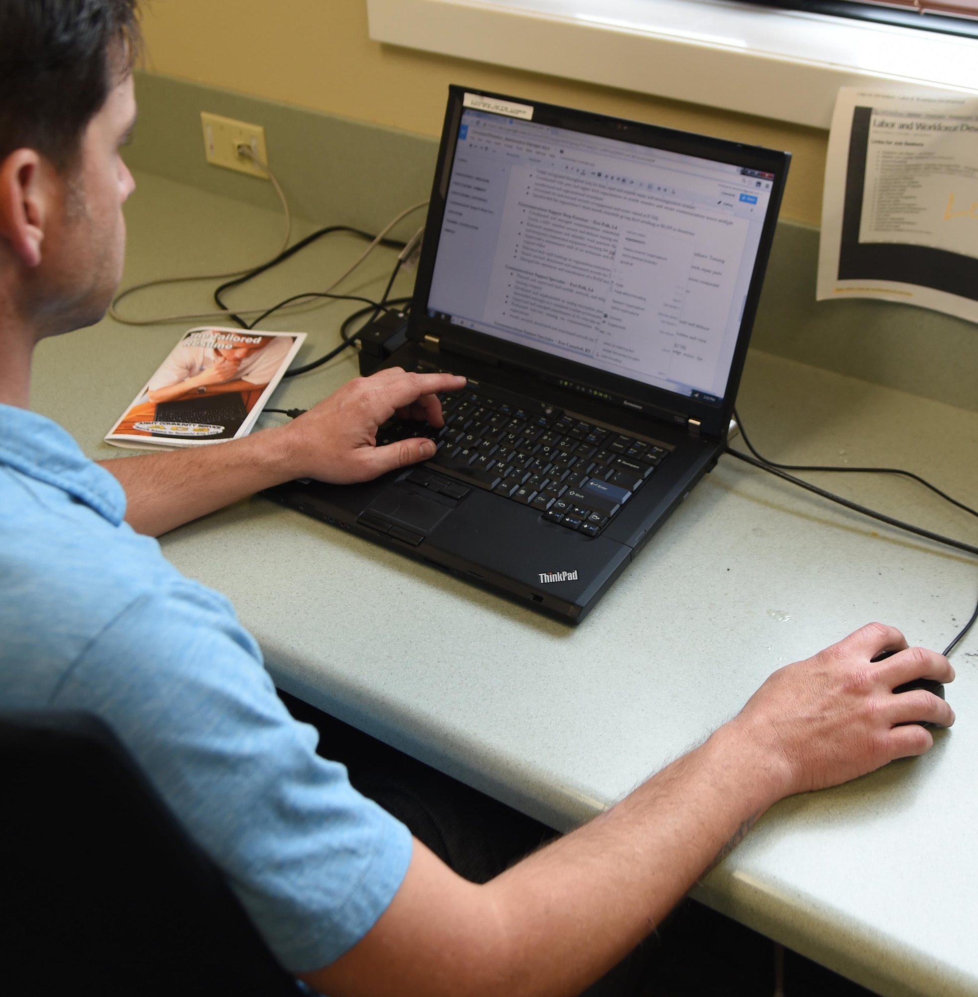 Sgt. 1st Class Christopher Wheadon, transitioning service member and Strategic Life Planning program client, reviews his resume at the Service Member and Family Assistance Center in preparation for seeking civilian employment. The program is a service that helps separating or retiring service members who are ill, injured or wounded define a goal and plan for transitioning to civilian life. (U.S. Air Force photo by Tech. Sgt. Vernon Cunningham)