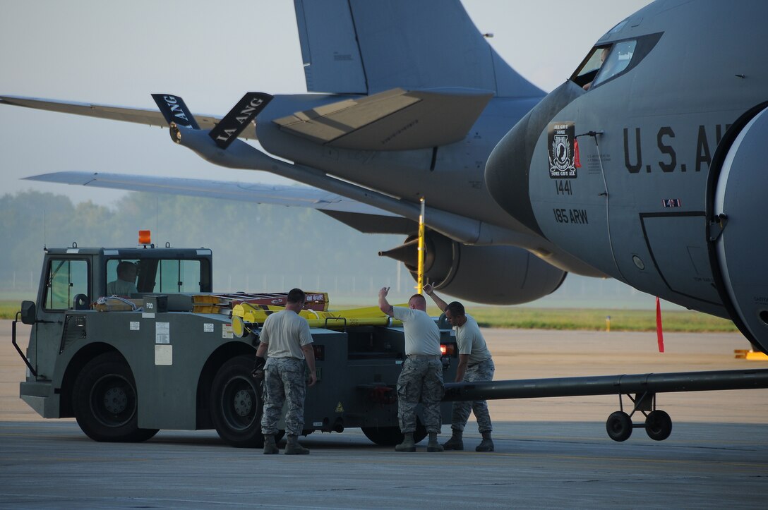 Crew Chiefs from the 185th Air Refueling Wing move a KC-135 Stratotanker to its spot on the ramp at Iowa Air National Guard base in Sioux City, Iowa on August 17, 2016.
U.S. Air National Guard Photo by Master Sgt. Vincent De Groot