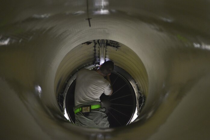 U.S. Air Force Staff Sgt. Alec Dyer, a 354th Maintenance Squadron aerospace propulsion craftsman, checks to make sure the engine of an F-16 Fighting Falcon has enough room to be pulled out Aug. 12, 2016, during RED FLAG-Alaska 16-3, in the phase shop at Eielson Air Force Base, Alaska. It is important that the engine has enough clearance when it is being removed from the aircraft. (U.S. Air Force photo by Airman Isaac Johnson)
