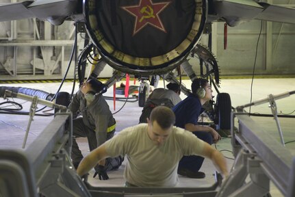 U.S. Air Force Airmen assigned to the 354th Maintenance Squadron work on an F-16 Fighting Falcon aircraft Aug. 12, 2016, in the phase shop at Eielson Air Force Base, Alaska, during RED FLAG-Alaska (RF-A) 16-3. The F-16 Fighting Falcon is a compact, multi-role fighter aircraft, which the 18th Aggressor Squadron uses to simulate adversaries during RF-A. (U.S. Air Force photo by Airman Isaac Johnson)
