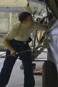 U.S. Air Force Staff Sgt. Jeffrey Jin, a 354th Maintenance Squadron aerospace propulsion craftsman, helps prepare an F-16 Fighting Falcon aircraft for the engine to be removed Aug. 12, 2016, during RED FLAG-Alaska 16-3, in the phase shop at Eielson Air Force Base, Alaska.This engine is being pulled so that the Joint Service Electrical Combat Systems Tester can be replaced. (U.S. Air Force photo by Airman Isaac Johnson)