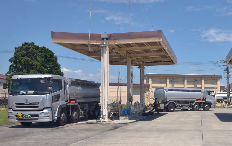 Fuel trucks arrive in the 374th Logistics Readiness Squadron fuels yard to deliver JP8 fuel at Yokota Air Base, Japan, Aug. 17, 2016. Eight fuel trucks delivered 40,000 gallons of fuel as they trained to receive fuel through an alternate source. (U.S. Air Force photo by Senior Airman David Owsianka/Released)