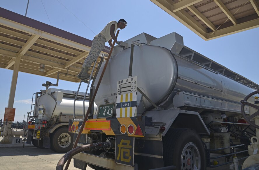 Staff Sgt. Daniel Shelly, 374th Logistics Readiness Squadron fuels laboratory technician, checks the seal numbers on the fuel truck at Yokota Air Base, Japan, Aug. 17, 2016. By checking the seal numbers, Shelly ensures the fuel has not been tampered with. (U.S. Air Force photo by Senior Airman David Owsianka/Released)
