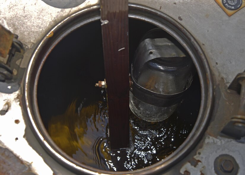 Fuel is returned to a fuel truck after Staff Sgt. Daniel Shelly, 374th Logistics Readiness Squadron fuels laboratory technician, performed a visual inspection at Yokota Air Base, Japan, Aug. 17, 2016. The visual inspection is performed to look for water or any other type of contamination. (U.S. Air Force photo by Senior Airman David Owsianka/Released)