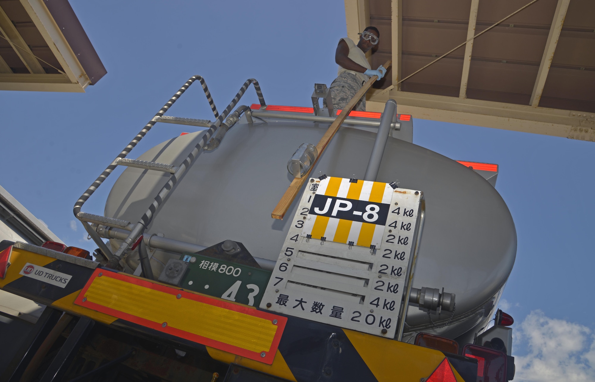Staff Sgt. Daniel Shelly, 374th Logistics Readiness Squadron fuels laboratory technician, performs a visual inspection on JP8 fuel at Yokota Air Base, Japan, Aug. 17, 2016. The visual inspection is performed to look for water or any other type of contamination. (U.S. Air Force photo by Senior Airman David Owsianka/Released)