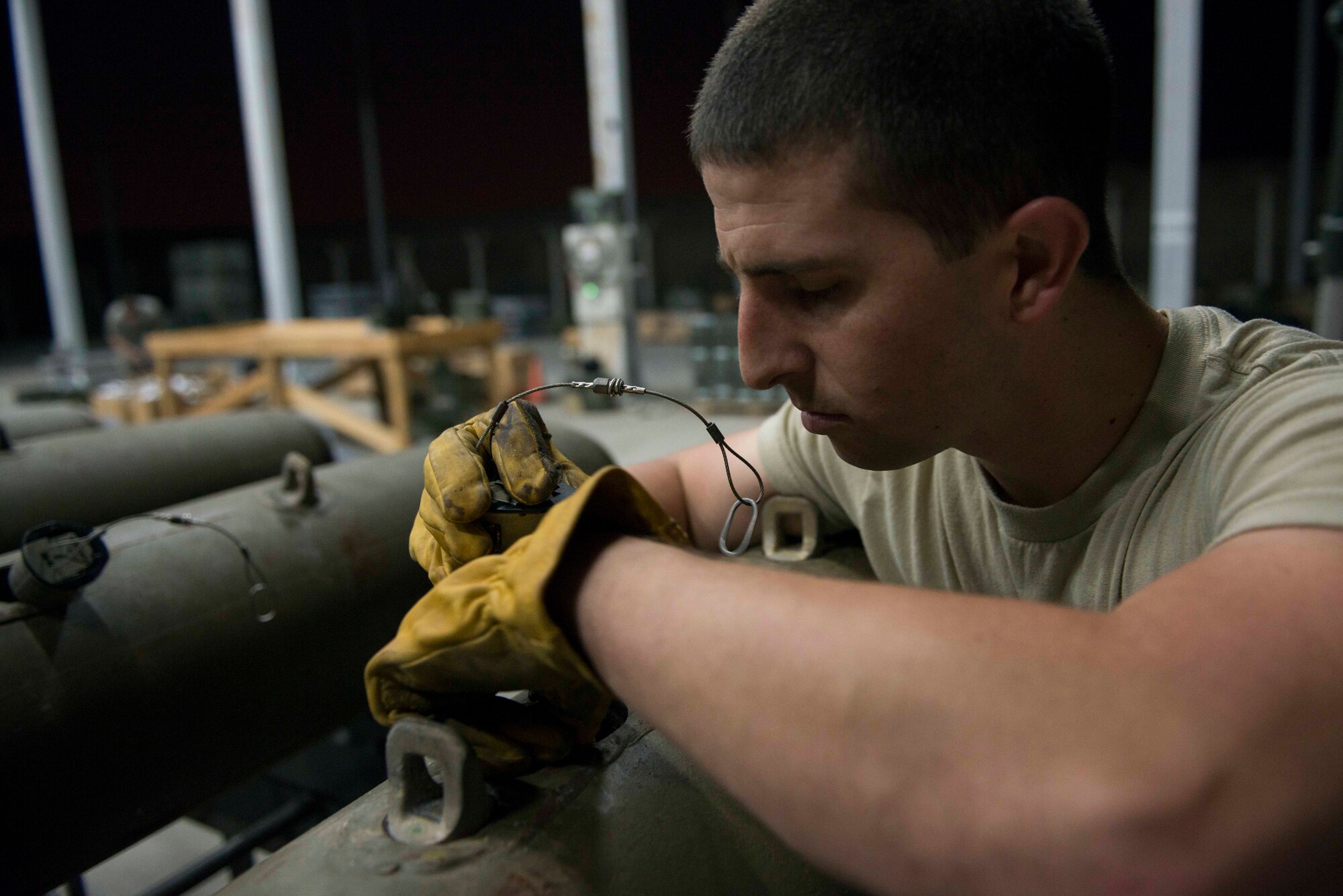 U.S. Air Force Staff Sgt. Curtis Downer, 447th Expeditionary Aircraft Maintenance Squadron munitions systems specialist, installs a part onto a GBU-12 Paveway II laser-guided bomb Aug. 8, 2016, at Incirlik Air Base, Turkey. Munitions systems specialists inspect, deliver and maintain guided and unguided non-nuclear munitions. (U.S. Air Force photo by Senior Airman John Nieves Camacho)