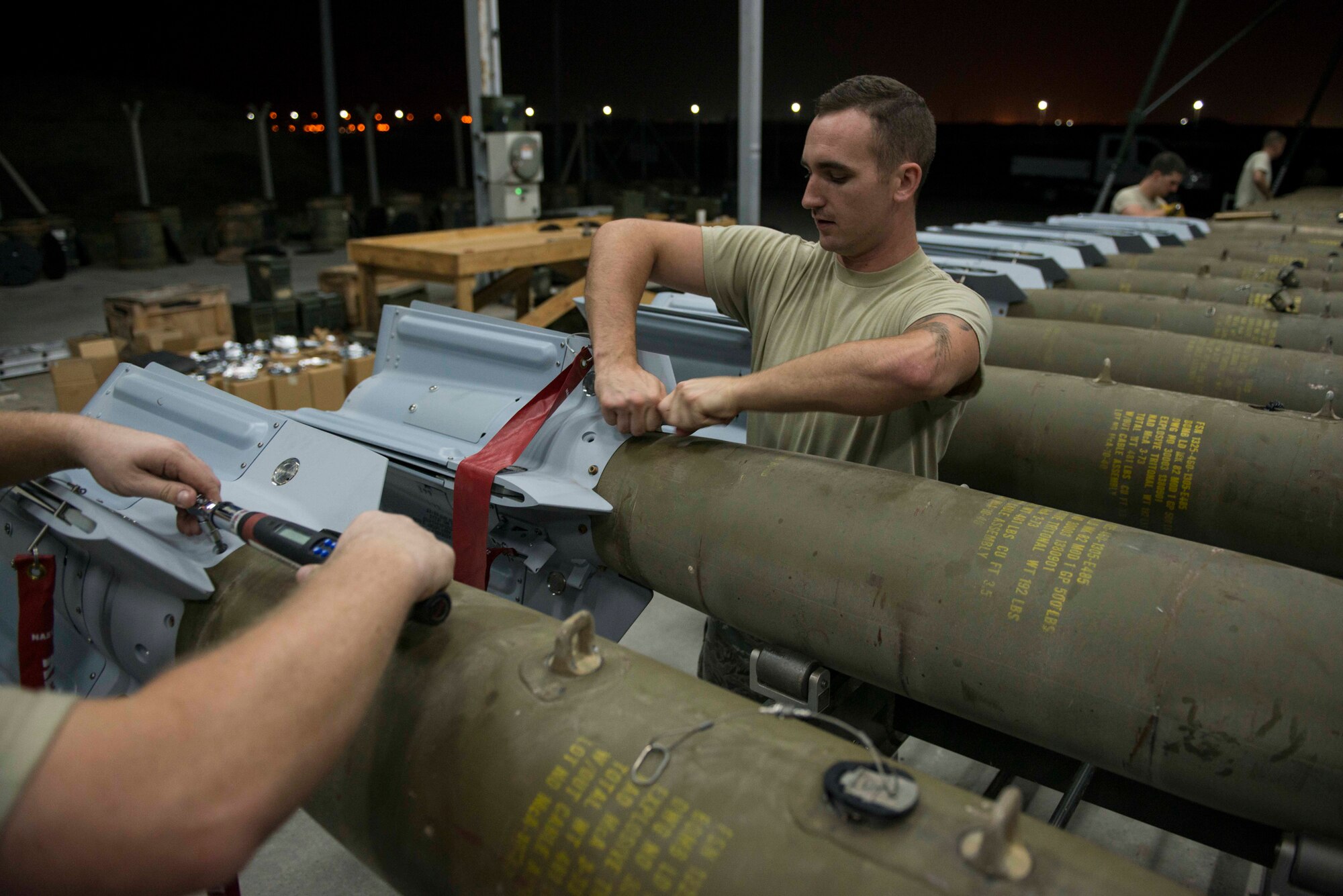 U.S. Airmen assigned to the 447th Expeditionary Aircraft Maintenance Squadron attach fins to GBU-12 Paveway II laser-guided bombs Aug. 8, 2016, at Incirlik Air Base, Turkey. Primarily, the aircraft they support is the A-10 Thunderbolt II, an aircraft designed for close air support of ground forces. (U.S. Air Force photo by Senior Airman John Nieves Camacho)