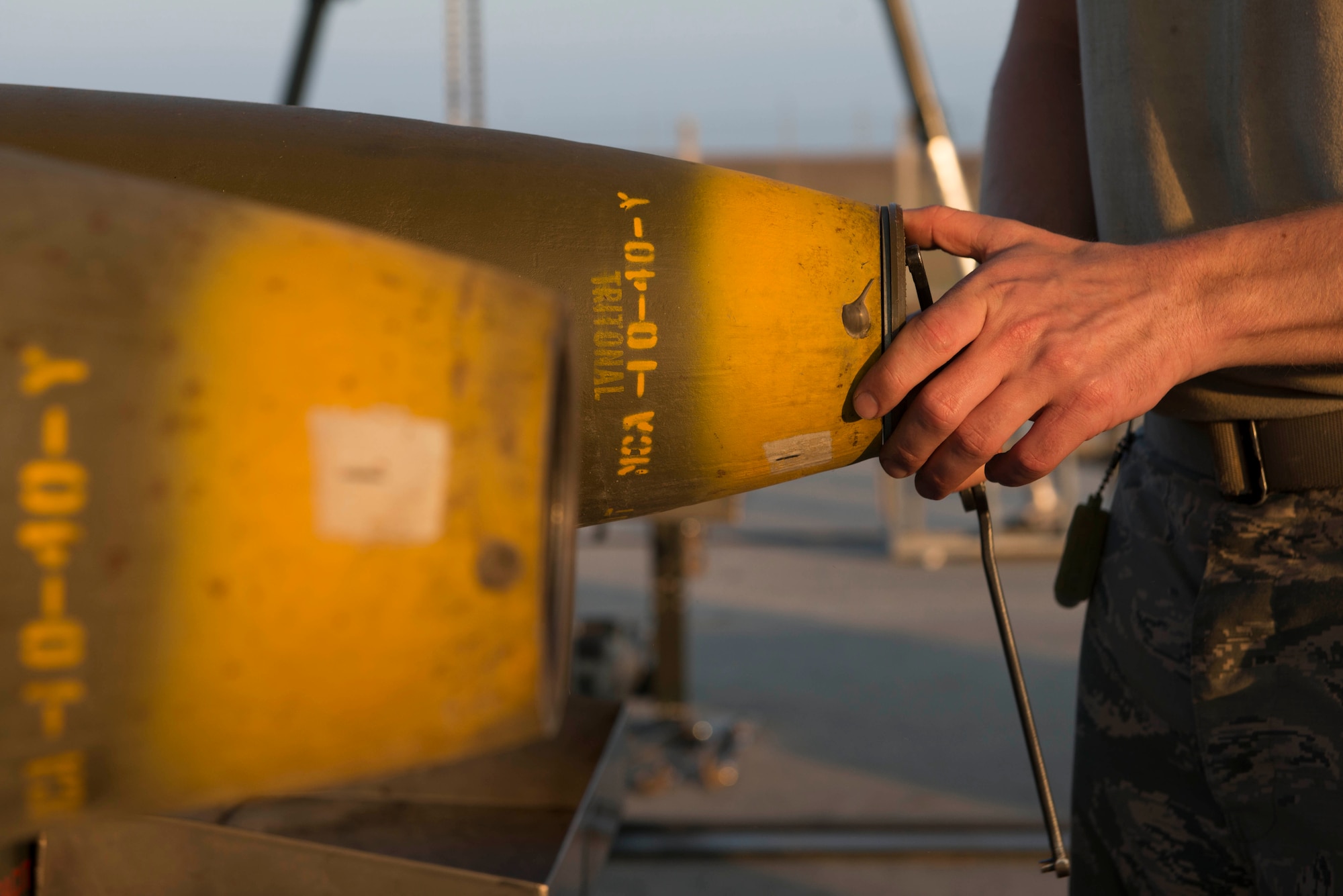 U.S. Air Force Staff Sgt. Shadrach Mchargue, 447th Expeditionary Aircraft Maintenance Squadron munitions systems specialist, installs a nose support coupler on a GBU-12 Paveway II laser-guided bomb Aug. 8, 2016, at Incirlik Air Base, Turkey. Munitions systems specialists receive, identify and store guided and unguided non-nuclear munitions. (U.S. Air Force photo by Senior Airman John Nieves Camacho)