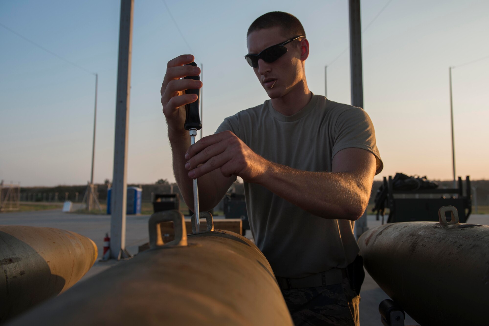 U.S. Air Force Staff Sgt. Shadrach Mchargue, 447th Expeditionary Aircraft Maintenance Squadron munitions systems specialist, builds a GBU-12 Paveway II laser-guided bomb Aug. 8, 2016, at Incirlik Air Base, Turkey. Once completed, munitions will be delivered to aircraft for installation or to a storage area. (U.S. Air Force photo by Senior Airman John Nieves Camacho)