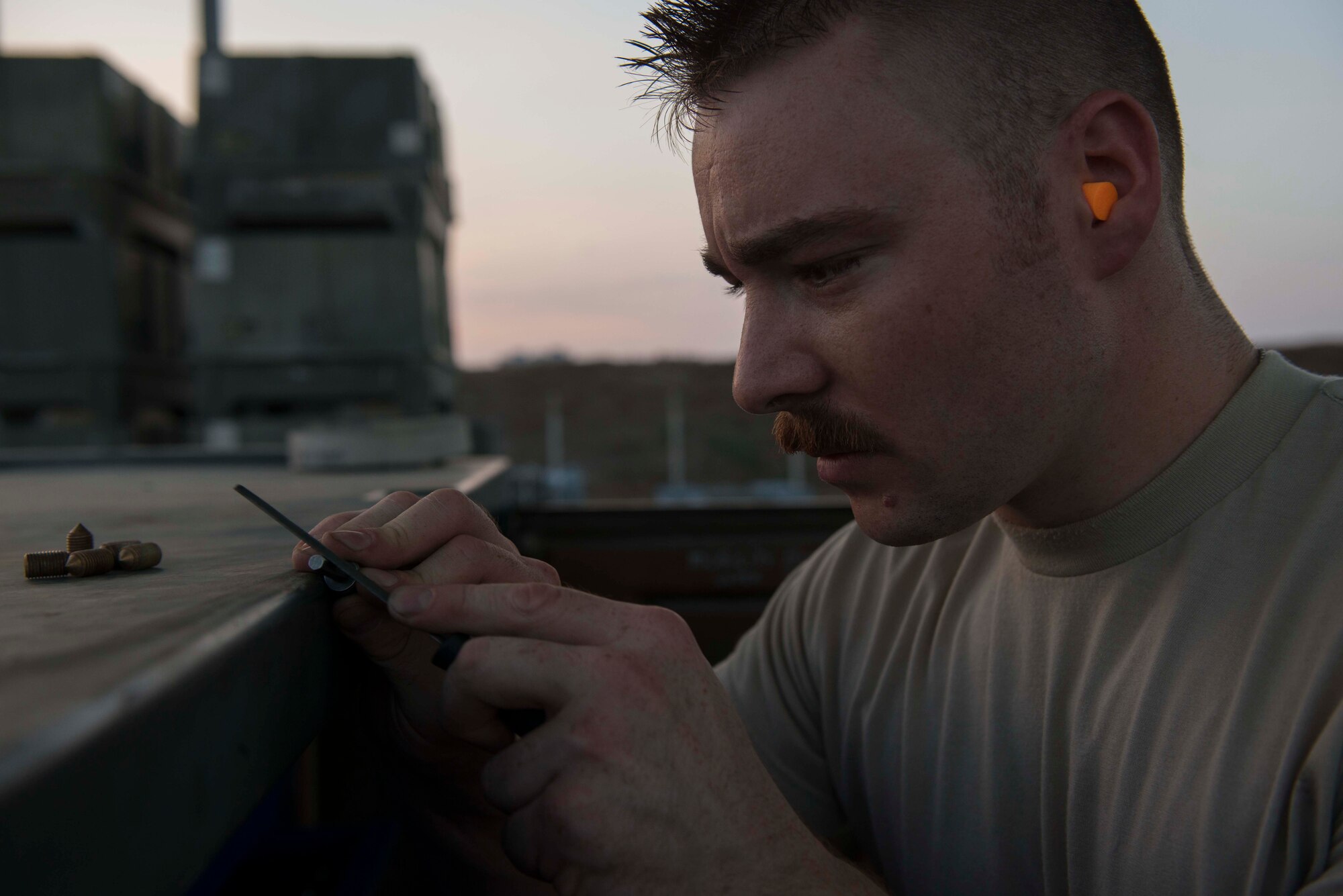 U.S. Air Force Staff Sgt. Nicholas Rendo, 447th Expeditionary Aircraft Maintenance Squadron munitions systems specialist, prepares an accessory for assembly to a GBU-12 Paveway II laser-guided bomb Aug. 8, 2016, at Incirlik Air Base, Turkey. Munitions are prepared, inspected and delivered by munitions systems specialists. (U.S. Air Force photo by Senior Airman John Nieves Camacho)