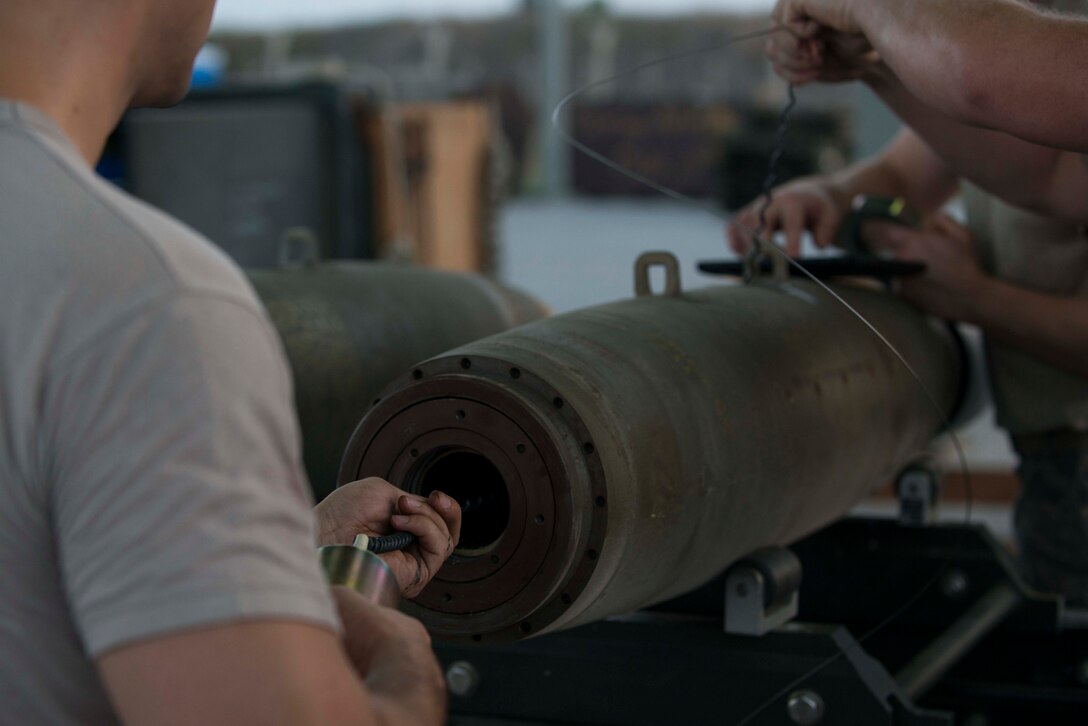 U.S. Airmen assigned to the 447th Expeditionary Aircraft Maintenance Squadron (EAMXS) perform maintenance on a GBU-12 Paveway II laser-guided bomb Aug. 8, 2016, at Incirlik Air Base, Turkey. The Airmen assembled multiple GBU-12s for aircraft and storage. (U.S. Air Force photo by Senior Airman John Nieves Camacho)