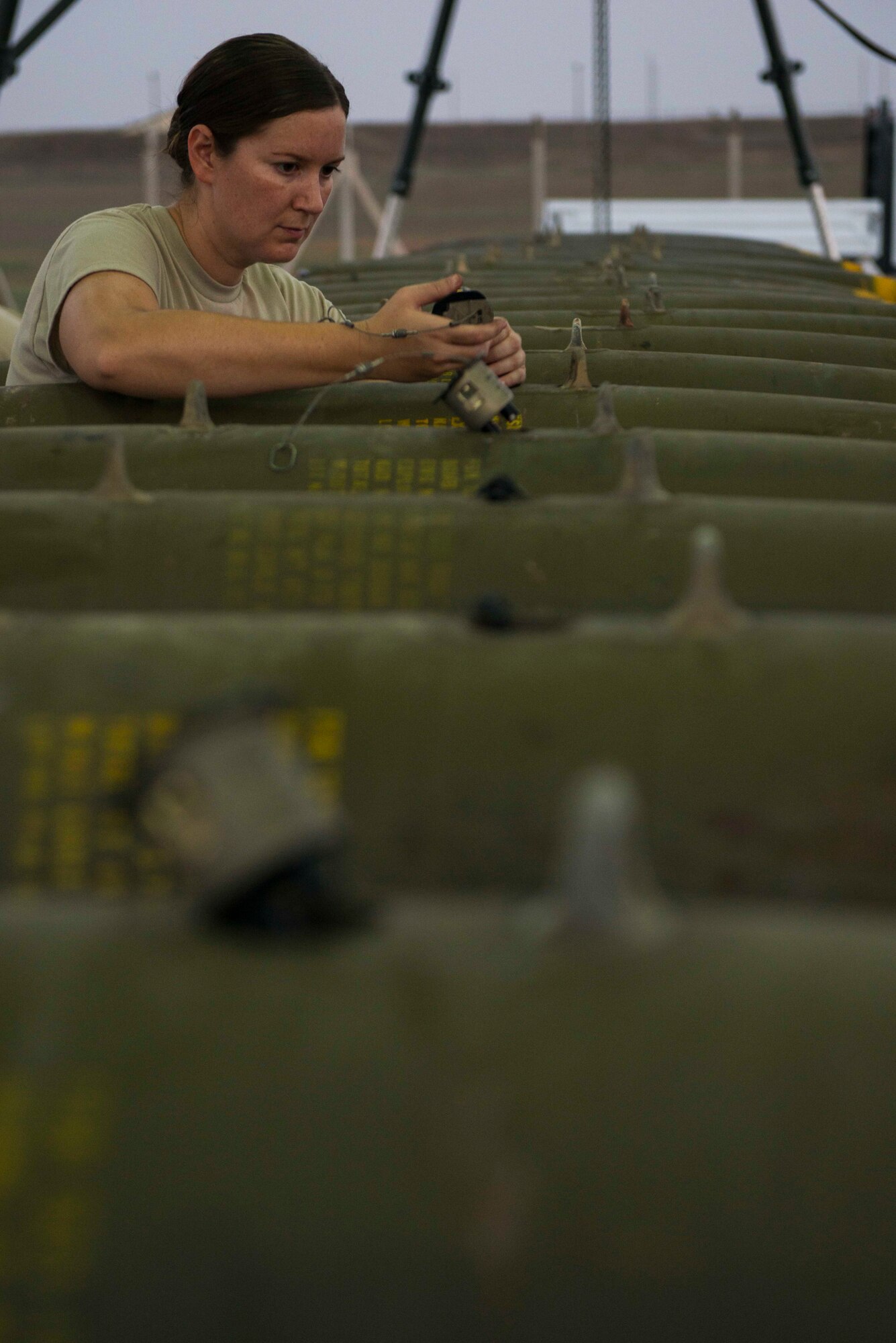 U.S. Air Force Master Sgt. Patricia Winn, 447th Expeditionary Aircraft Maintenance Squadron munitions systems specialist, installs a part onto a GBU-12 Paveway II laser-guided bomb Aug. 8, 2016, at Incirlik Air Base, Turkey. Munitions systems specialists receive, identify and store guided and unguided non-nuclear munitions. (U.S. Air Force photo by Senior Airman John Nieves Camacho)