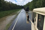 Louisiana National Guardsmen convoy to a boat launch in order to conduct door-to-door Search and Rescue missions near Maurepas, La., Aug. 17, 2016. The Louisiana National Guard continues to conduct response efforts, recovery missions, and preposition vehicles and assets in potentially affected areas, as directed by Gov. John Bel Edwards, since operations began, Aug. 12. 