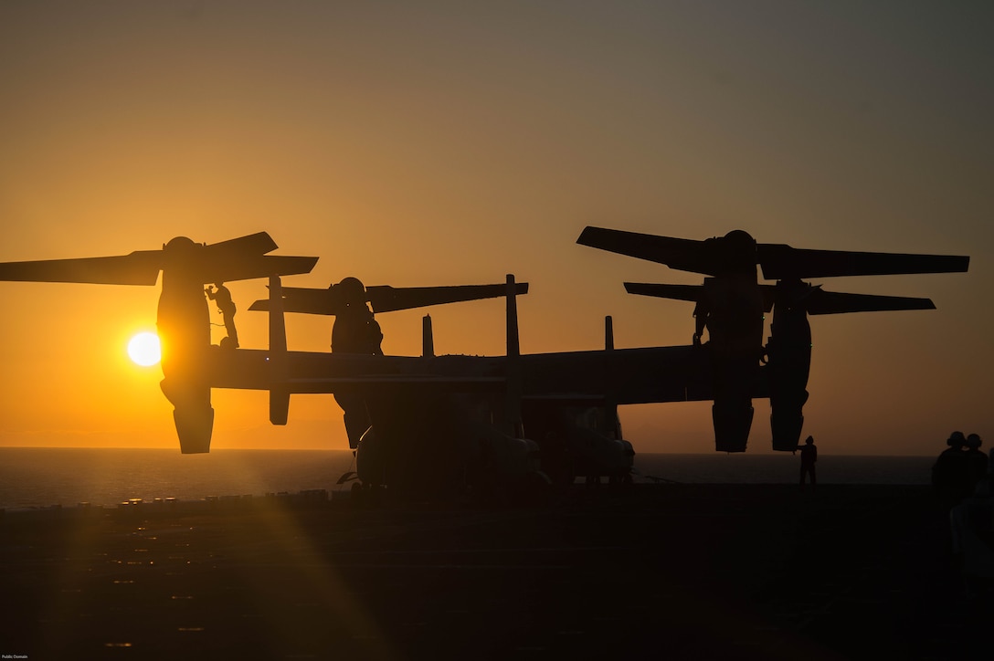 Marines assigned to Marine Medium Tiltrotor Squadron 163 (Reinforced) perform maintenance on an MV-22 Osprey on the USS Makin Island flight deck.  Makin Island is underway conducting Composite Training Unit Exercise with Amphibious Squadron Five and the 11th Marine Expeditionary Unit in preparation for an upcoming deployment.  
