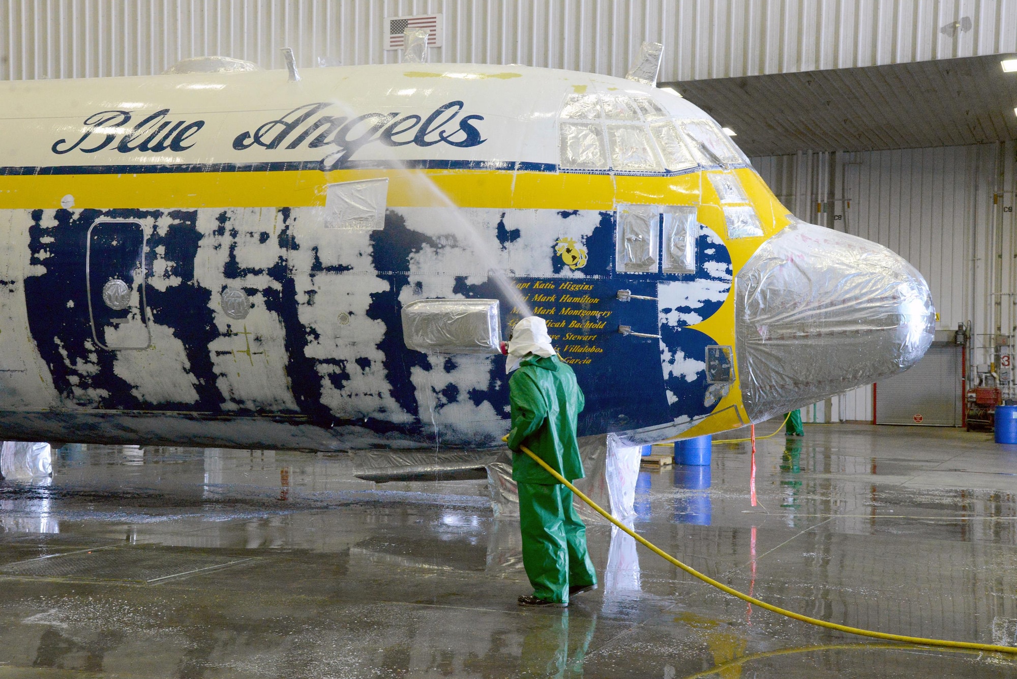 Fat Albert, the Blue Angels’ C-130 cargo plane used for transporting crew and equipment to air shows around the country, is currently undergoing a chemical de-paint process here at Tinker after severe corrosion was found on it. It will take crews working three continuous shifts to thoroughly clean the aircraft of all paint, using a stripping agent to remove one layer at a time. Once the de-paint process and sheetmetal checks for any other corrosion are complete, Fat Albert will fly to Hill Air Force Base, Utah, for full programmed depot maintenance and paint. (Air Force photo by Kelly White)