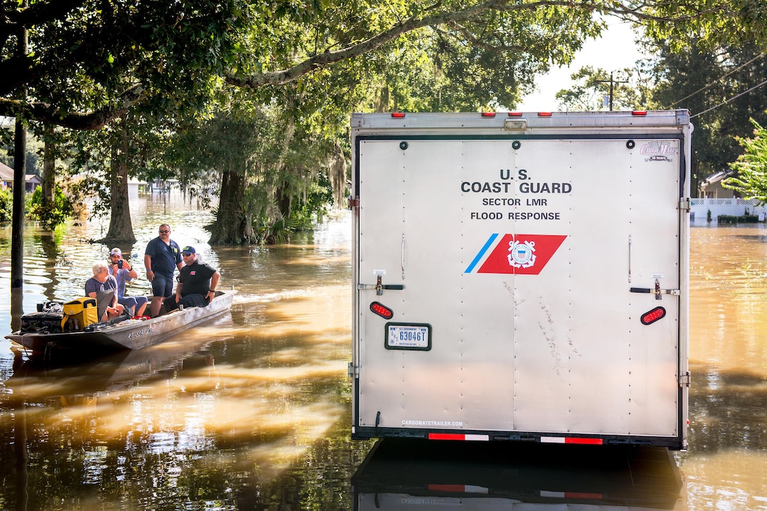Members of the Coast Guard assist the Saint Amant Fire Department amid severe flooding in Baton Rouge, La., Aug. 16, 2016. Coast Guard photo by Petty Officer 2nd Class LaNola Stone