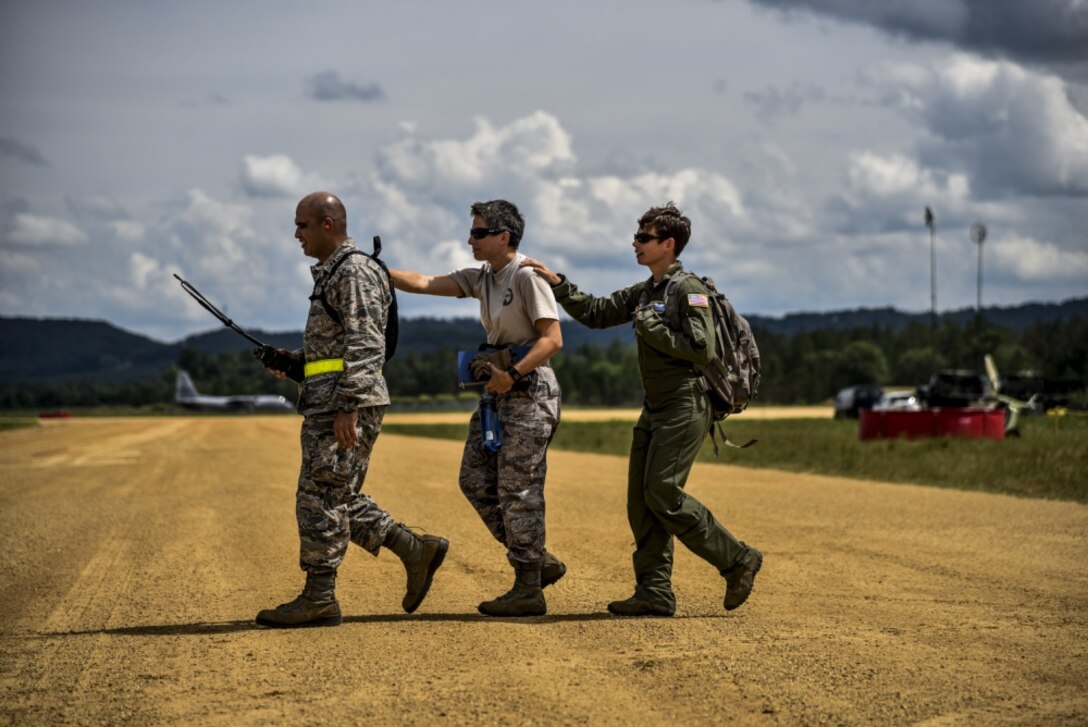 45th Aeromedical Evacuation Squadron team members prepare to board a C-130 Hercules at Fort McCoy, Wis., AUgust 15, 2016 during exercise PAtriot Warrior. Patriot Warrior is a joint exercise designed to demonstrate contingency deployment training ranging from bare base buildup to full operational capabilities. More than 11,000 members from the U.S. service branches and their Reserve components, including Air Force, Army, Navy, and Marines are participating alongside British, Canadian, and Saudi Arabian forces. This exercise evaluates the ability of Air Force Reserve units to deploy mobility airlift and agile combat support capabilities in support of joint theater operations. (U.S. Air Force photo by Staff Sgt. Adam C. Borgman) 