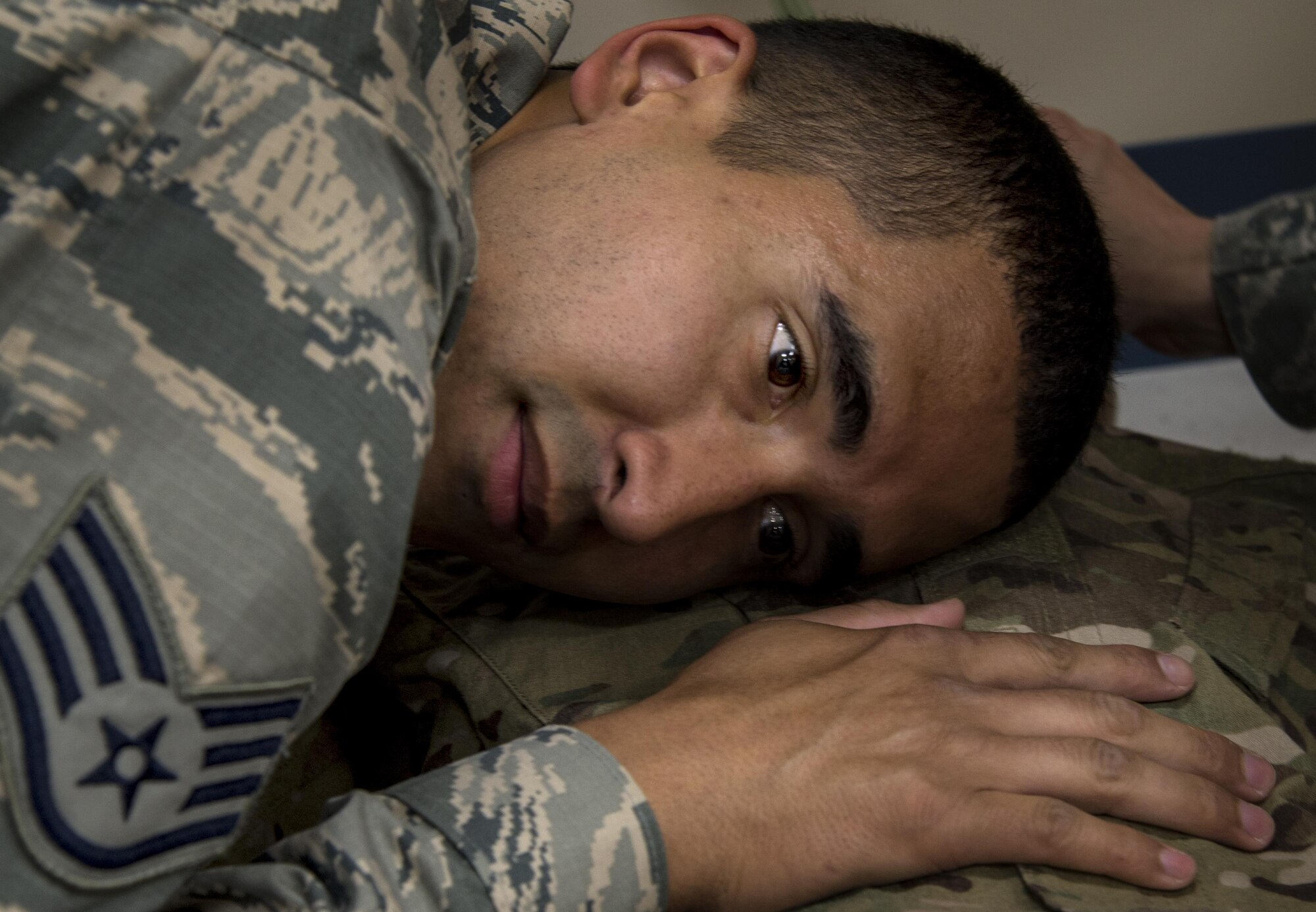 Staff Sgt. Orlando Navarro listens to the heartbeat of a simulated patient. “I am excited to test myself and I’ve enjoyed training with my fellow Airmen,” Navarro said about participating in the EMT Rodeo.