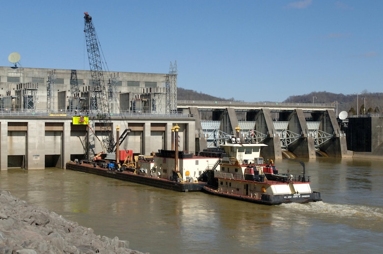 A U.S. Army Corps of Engineers Nashville District maintenance crew on the Iroquois from the Cumberland River Operations Center installs a sign at Cordell Hull Dam Feb. 26, 2014.  The district's repair fleet is being reorganized into a regional light repair fleet effective Oct. 1, 2016.