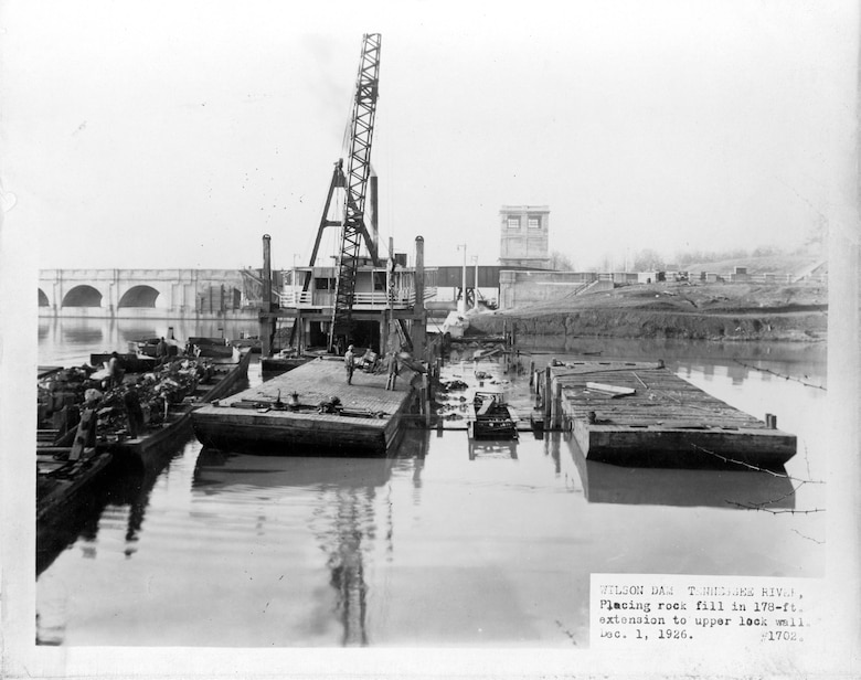 The repair fleet places rock fill in a 178-foot extension of the upper lock wall at Wilson Lock in Florence, Ala., Dec. 1, 1926. The district's repair fleet is being reorganized into a regional light repair fleet effective Oct. 1, 2016.