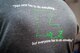 A shirt displays the Green Dot motto “no one has to do everything, but everyone has to do something” at Barksdale Air Force Base, La., Aug. 9, 2016. Recently, the Air Force contracted the non-profit Green Dot organization to take steps toward decreasing interpersonal violence, helping Airmen paint a canvas that does not accept blemishes of violence within the Air Force. (U.S. Air Force photo/Senior Airman Mozer O. Da Cunha)