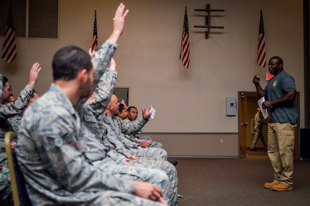 A Green Dot implementer asks Airmen, civilian workers, contractors and mission partners questions during Green Dot general overview training at Barksdale Air Force Base, La., Aug. 9, 2016. The Barksdale AFB Green Dot team consists of four coordinators and 14 implementers from Air Force Global Strike Command, 2nd Bomb Wing and the 307th Bomb Wing. (U.S. Air Force photo/Senior Airman Mozer O. Da Cunha)