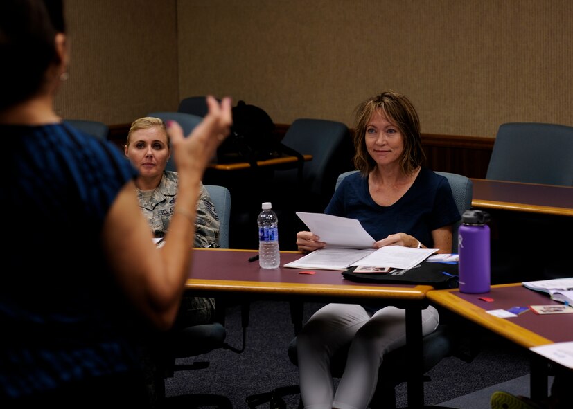 Liz Hernandez, spouse of Col. Michael Hernandez, 325th Fighter Wing commander, listens to an instructor at the Airman & Family Readiness Center, Aug. 16, 2016. Key spouses are volunteers appointed by each squadron and unit commander and trained at A&FRC. Key spouses welcome families to the unit, help disseminate information from leadership, offer support to families of deployed members and provide assistance to families in need. (U.S. Air Force photo by Senior Airman Solomon Cook/Released)