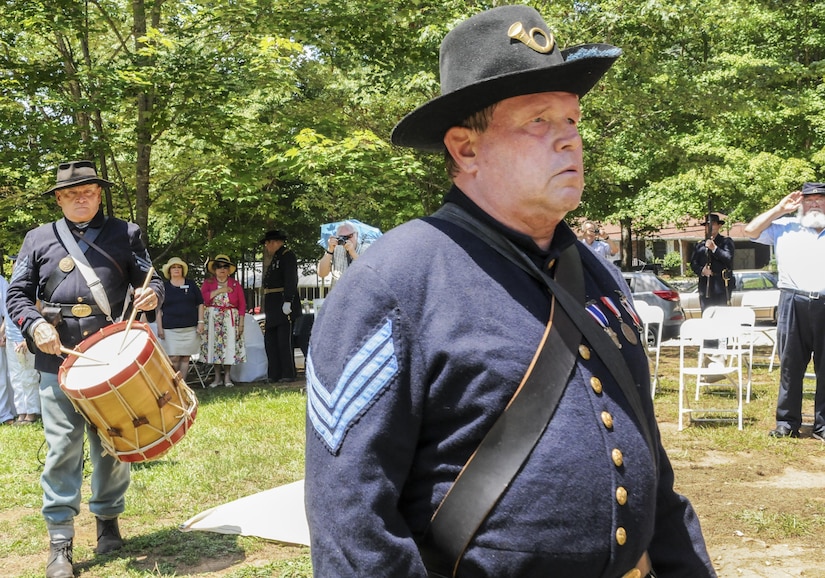 Allen H. Bright, sergeant of the color guard and a Civil War re-enactor of the Sons of Union Veterans of the Civil War, and Greg Krohn, a Civil War re-enactor of the 125th Ohio volunteer Infantry, march together in the color guard at the Cascade Nature Preserve, East Point, Georgia, Aug. 6, at the dedication of a historical marker recognizing the sacrifice of those who fought in the Battle of Utoy Creek Aug. 4-7, 1864 during the Atlanta Campaign of the American Civil War.  (U.S. Army photo by Sgt. Stephanie A. Hargett) (Released)