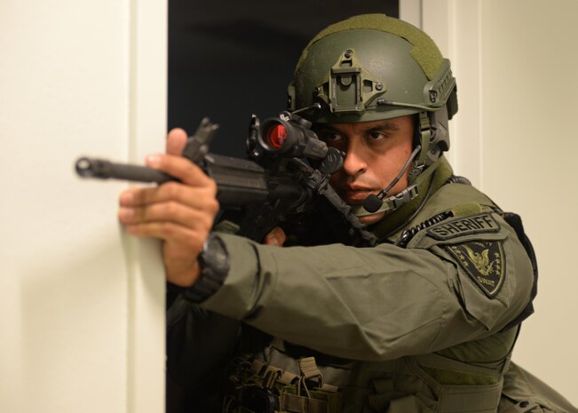 Deputy Sixto Torres, Yuba County Sheriff's Department SWAT, stands guard during an active shooter exercise Aug. 17, 2016, at Beale Air Force Base, California. Beale personnel and Yuba County SWAT worked cohesively to extract individuals on lockdown and eliminate the simulated threat. (U.S. Air Force photo by Senior Airman Ramon A. Adelan) 