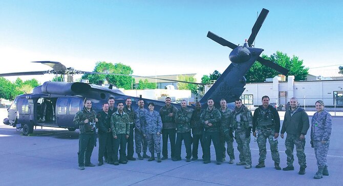 Pararescumen, Airmen from the 512th Rescue Squadron and support staff from the 58th Special Operations Wing pause for a photo after a successful search-and-rescue mission on Saturday night near Durango, Colorado. (Photo by Tech. Sgt. Derria Kemp)