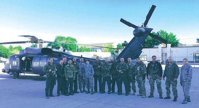 Pararescumen, Airmen from the 512th Rescue Squadron and support staff from the 58th Special Operations Wing pause for a photo after a successful search-and-rescue mission on Saturday night near Durango, Colorado. (Photo by Tech. Sgt. Derria Kemp)