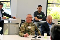 Maj. Gen. Michael Smith, deputy chief, U.S. Army Reserve, introduces himself to
Daniel Savage (not pictured), veterans program manager for LinkedIn, during a visit to LinkedIn’s headquarters, Mountain View, Calif., Aug. 12. Savage briefed Smith and Army Reserve Ambassadors from the 63rd Regional Support Command on the initiatives LinkedIn is taking to assist transitioning veterans in their journey to find work outside the military. (Army Reserve Photo by Alun Thomas)